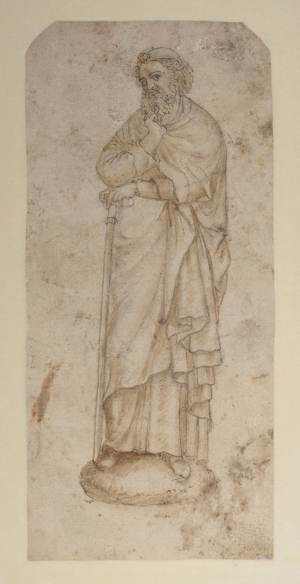 Figure barbue, drapé, tenant un bâton (tête tonsurée)